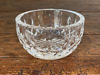 Small Waterford crystal bowl angled view showing cut patterns and clear glass.