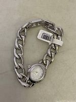 Hey Harper pearl silver chain link women's wristwatch with attached tag.
