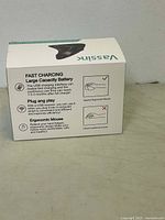 Side view of the boxed Vassink ergonomic vertical wireless mouse showing fast charging, large capacity battery and ergonomic design details