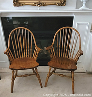 Front view of both chairs against fireplace