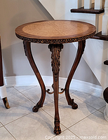 Full front view of round side table showing overall design and proportions