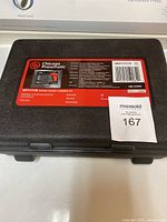 Closed black plastic carrying case with Chicago Pneumatic CP7111K label