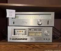 Front view of two stacked units, Pioneer stereo tuner TX-5500II on top and cassette tape deck CT-F500 below, showing overall condition and layout
