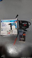 Mastercraft corded hammer drill with box, drill, and accessory set including drill bits and attachments.