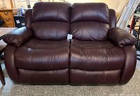 Front view of entire loveseat showing seating for two and overall condition