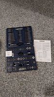 Full view of open Mastercraft 78 piece tap and die set showing taps, dies, and handles arranged in case with sheet included