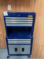 Front view of entire chest showing drawers, shelf and casters