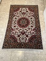 Full rug view on tile floor showing overall pattern and size