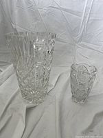 Both vases together showing the size difference and details of cut glass patterns