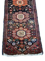 Close-up of upper section showing octagonal medallion and surrounding geometric motifs.