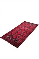 Image showing a Persian Baluchi red rug with black and white geometric patterns, rectangular and handmade with fringed edges.