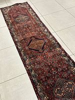 Full-length top-down view of the runner rug on tiled floor