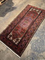 Full layout view showing entire rug on concrete floor