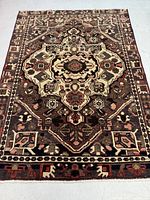 Full view of rug showing overall pattern, color palette and condition