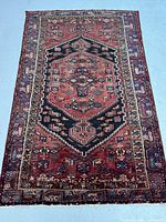 Overall view of rug face showing full pattern and field colors