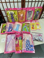 Overview of all 11 unopened Barbie outfit and accessory packages from 2000, showing variety and packaging style