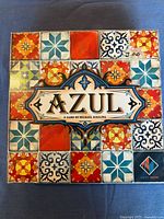 Front of Azul board game box with colorful tile design and branding.