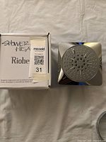 Photo showing Riobel branded box and 2-jet shower head with arm, new condition.