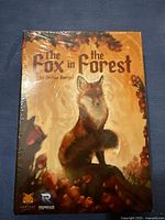 Front view of boxed card game The Fox in the Forest by Joshua Buergel, sealed in shrink wrap