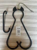 View of solid steel clanger hook and curved striker for the dinner gong triangle set, showing black gloss enamel finish.