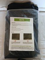 Photo of the screened mesh folded in original plastic packaging with instruction sheet showing application and installation guidance