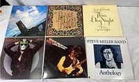 Collection of six 12-inch LP vinyl records featuring three albums by Three Dog Night and three by the Steve Miller Band laid out in two rows.
