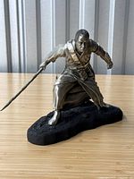 Front three-quarter view of Chirrut Îmwe figurine on black base