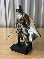 Front view of the pewter Darth Vader figurine on black base.