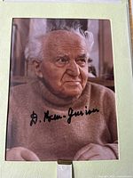 Signed 8x10 photograph inside white vinyl folder