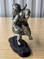 Front view of Baze Malbus figurine on black resin base