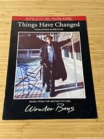 Front cover, full view showing title, cover art, and autograph