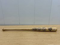 Full-length view of the bat on wooden surface