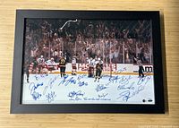Full view of framed Rangers photograph on wood surface