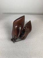 Pair of pointed-toe wooden shoe lasts with dark brown finish and metal adjustment hardware