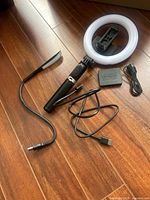 Full view of LED ring light, tripod stand, USB cable, phone holder, and HDMI splitter