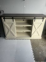 Front view showing center section open with sliding doors at sides