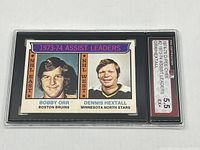 Photo of the front of the KSA graded 1974-75 Bobby Orr and Dennis Hextall hockey card showing the graded slab and label.