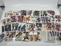 Top-down photo showing hockey cards spread out with clear player images and logos.