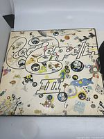 Front cover of Led Zeppelin III LP showing colorful psychedelic artwork and Led Zeppelin logo.