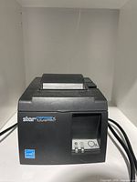 Front view of black Star TSP100III FuturePRNT thermal receipt printer showing front control panel and branding.