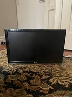 Front view of LG small flat screen TV showing black bezel and LG logo
