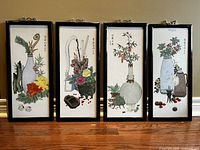 Set of 4 Asian-inspired color prints on framed porcelain tiles arranged side by side showing all four designs and frames.