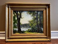 Framed oil painting of Quiet Bay, Tudhope Bay Orilla Ont. showing the artwork and frame with visible texture and color details.