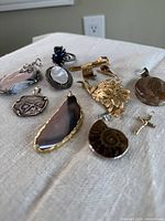 Overview of all ten jewelry pieces laid flat on fabric