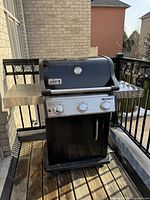 Front view of closed grill showing overall body and lid