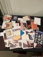 Overview of assorted blank greeting cards, envelopes, and stationery items displayed on a surface.
