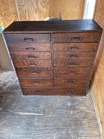 Front view of cabinet showing drawer layout and overall condition