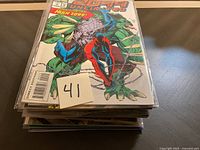 Stack of comic books with '2099 Unlimited' #1 on top, featuring Spider-Man and Hulk Z099 in front cover, bagged for protection.