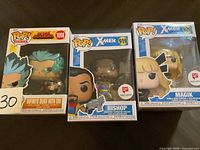 Three boxed Funko Pop! Animation and X-Men figures (Infinite Deku with Eri, Bishop, Magik) shown from front view.