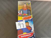 Front view of Justice League Superman action figure in original packaging showing the box and figure clearly.